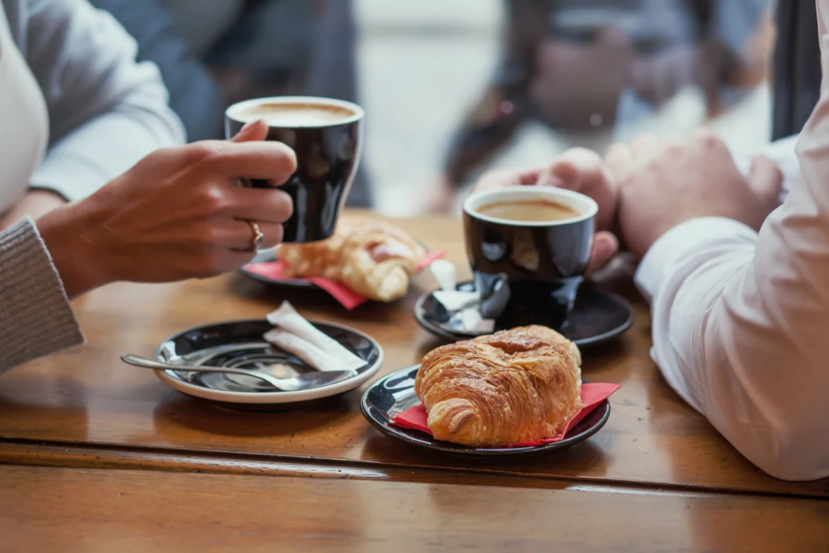 Coffee shop team member serving customers